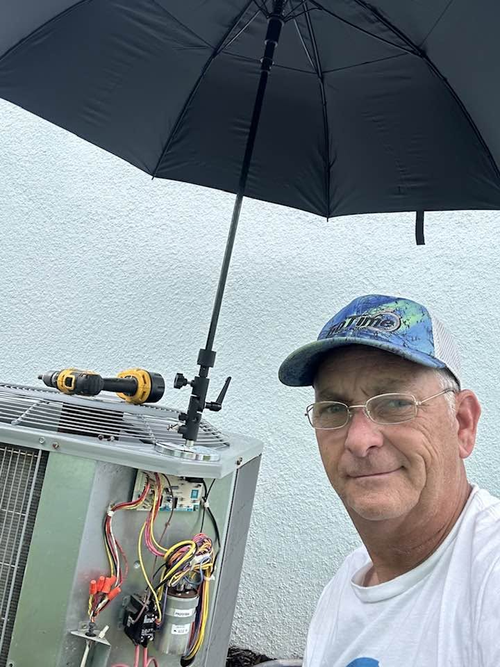 Tomco HVAC technician on an air conditioner installation job