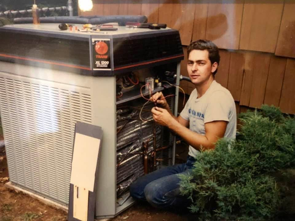 A young Tom wiring a Trane XL 1200 air conditioner